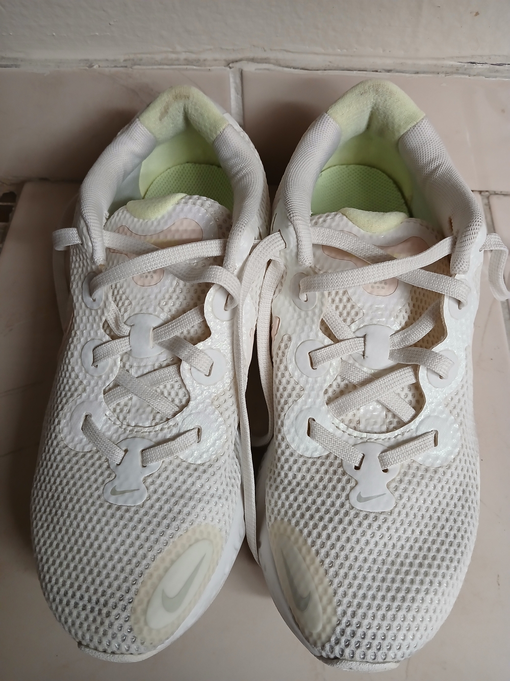Nike Women's White Mesh Running Shoes with Pale Green Accents